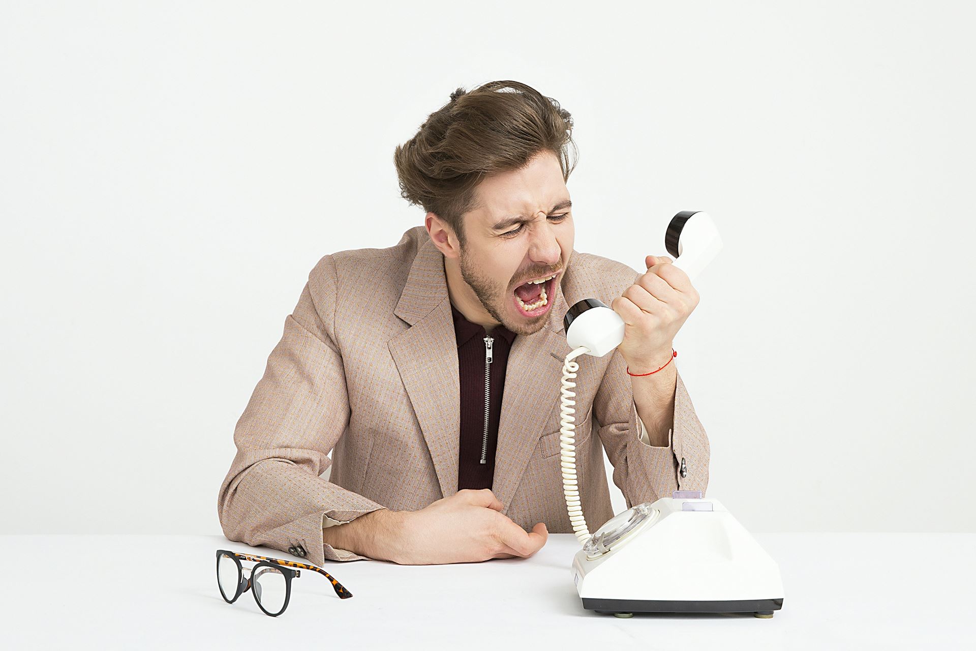 man shouting down phone