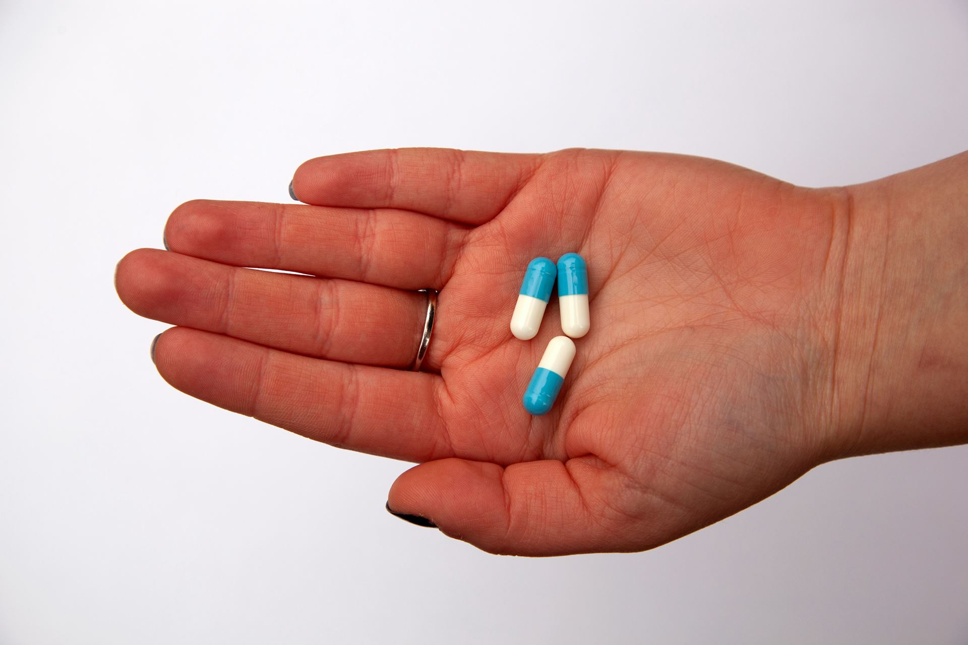 hand holding capsule medications