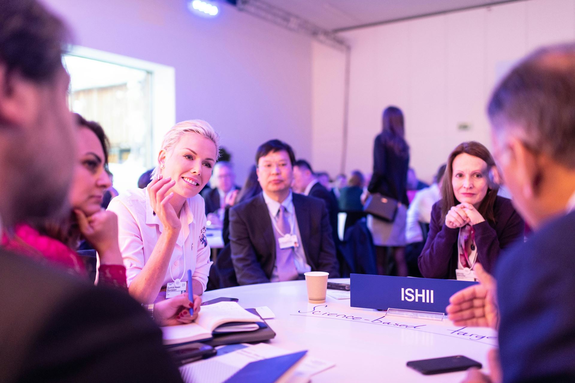 people around a table at a conference