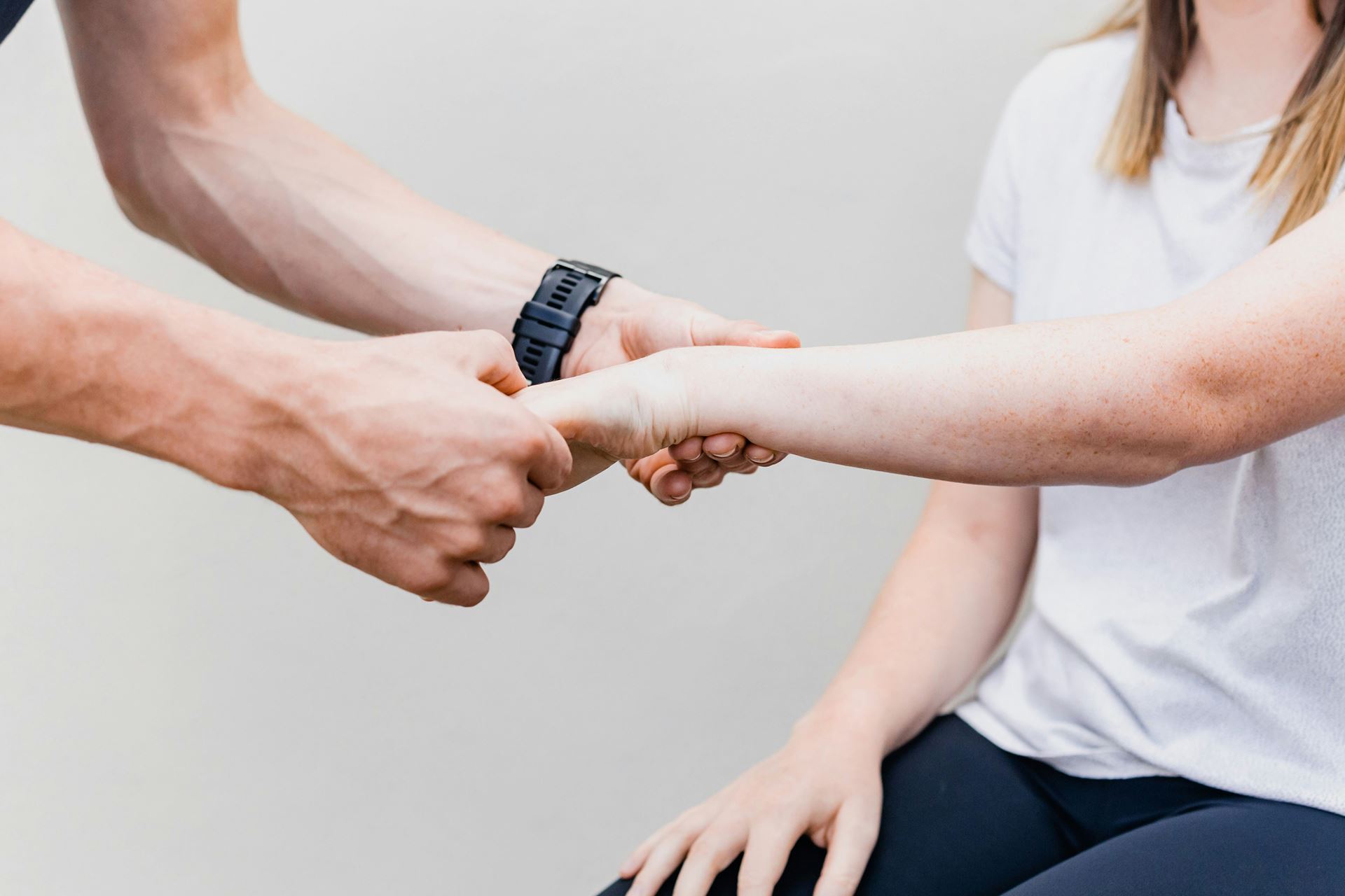 hands massaging a wrist